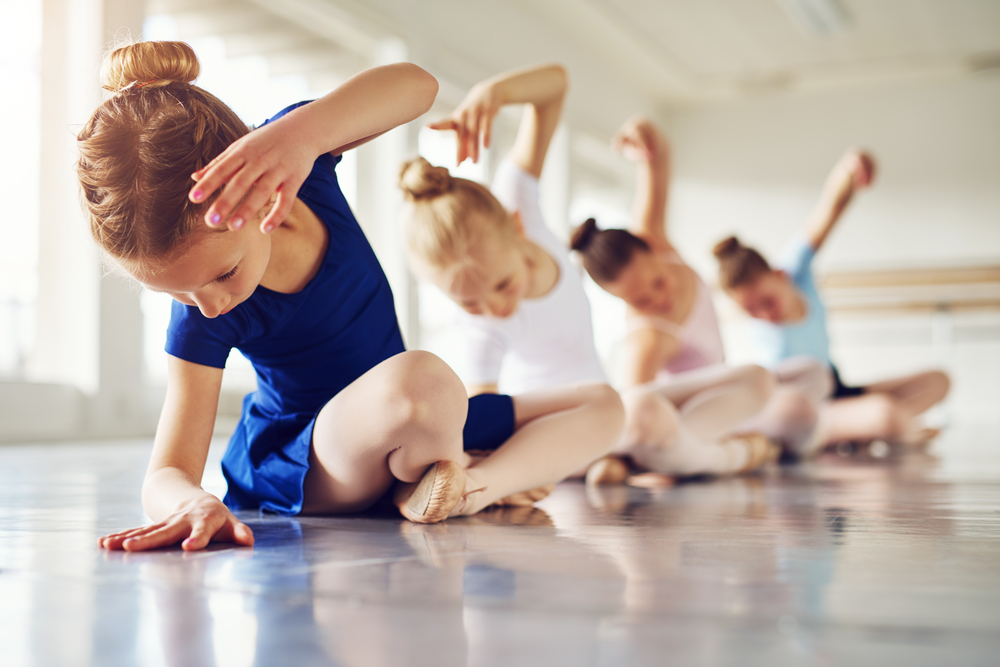 Kids doing ballet in a dance studio